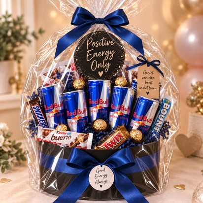 Luxe zwarte ronde cadeaubox met vijf blikjes Red Bull, chocolade, pralines, donkerblauwe strik en decoratieve Positive Energy-k